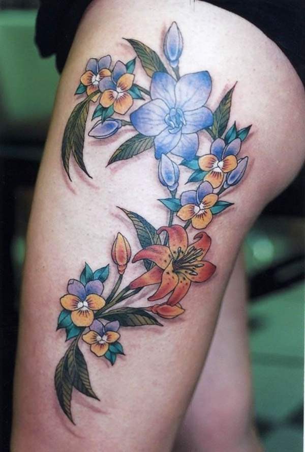 Beautiful colorful flower tattoo for girls on thigh - Tattooimages.biz