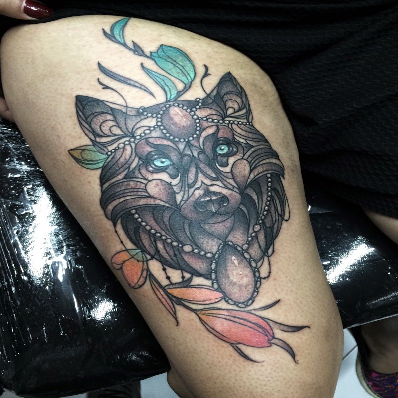 Modern style colored thigh tattoo of wolf with jewelry and feather