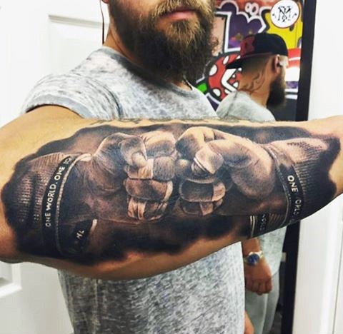 Stunning realism style colored fighters fists tattoo on forearm