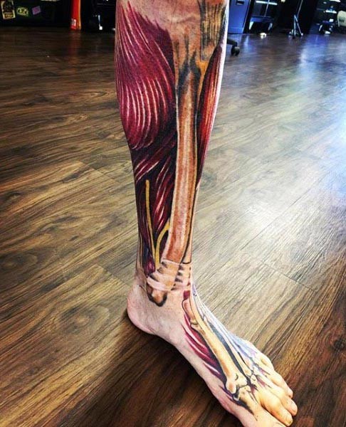 Unbelievable multicolored foot and leg tattoo of realistic bones and