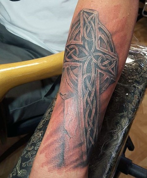 3D like ancient Celtic cross black ink tattoo on arm