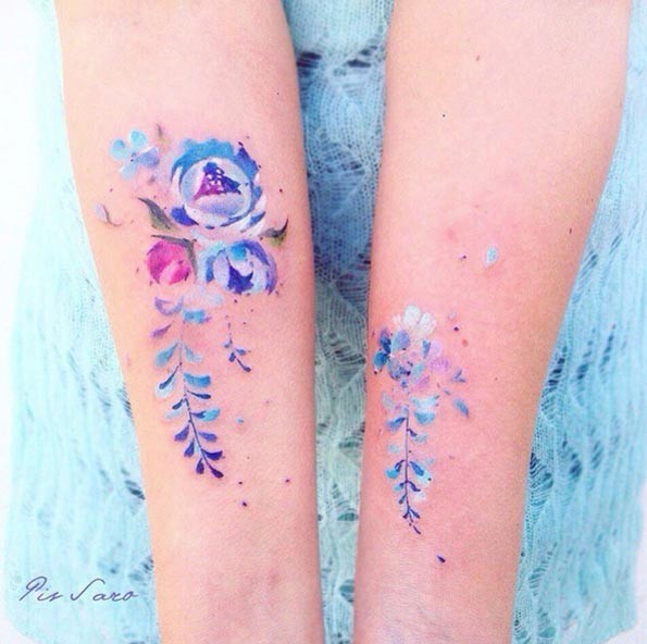 3D like beautiful looking colored flowers tattoo on foreram
