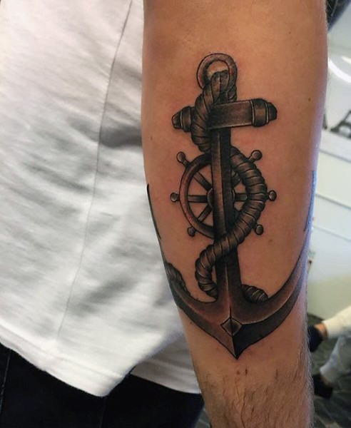 3D like big black and white anchor with steering wheel tattoo on arm
