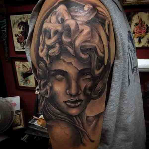 3D like big black and white antic medusa head tattoo on shoulder