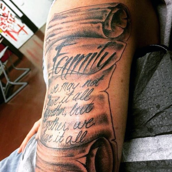 3D like big black and white old lettering tattoo on shoulder area