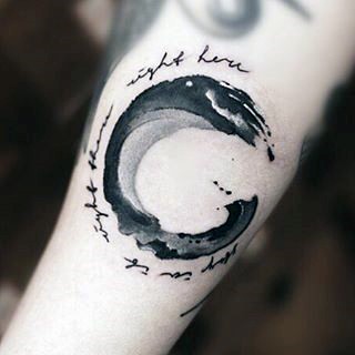 3D like big black ink mystical wave shaped tattoo with lettering on arm