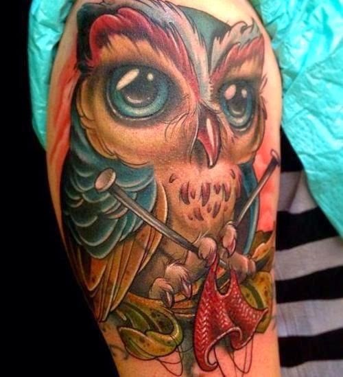 3D like big natural looking colorful shoulder tattoo of owl with knitting