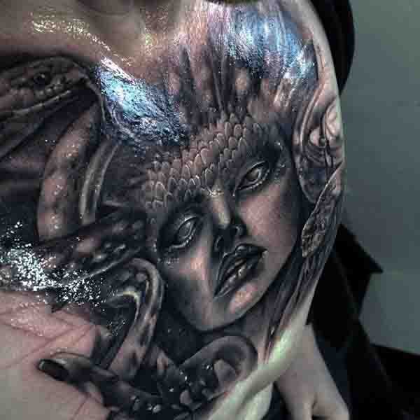 3D like black and white detailed evil Medusa head tattoo on chest