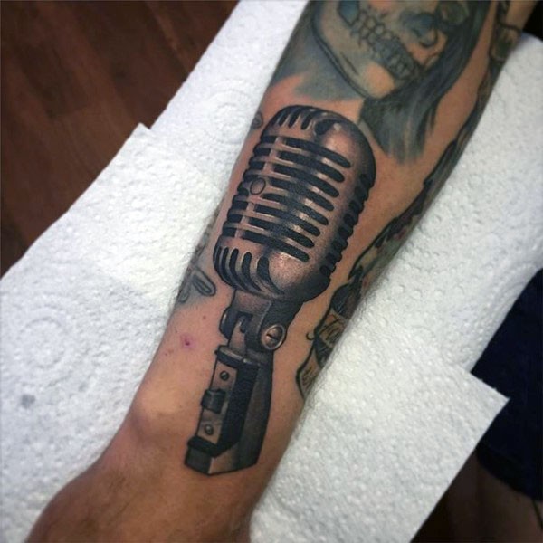 3D like black and white microphone tattoo on leg