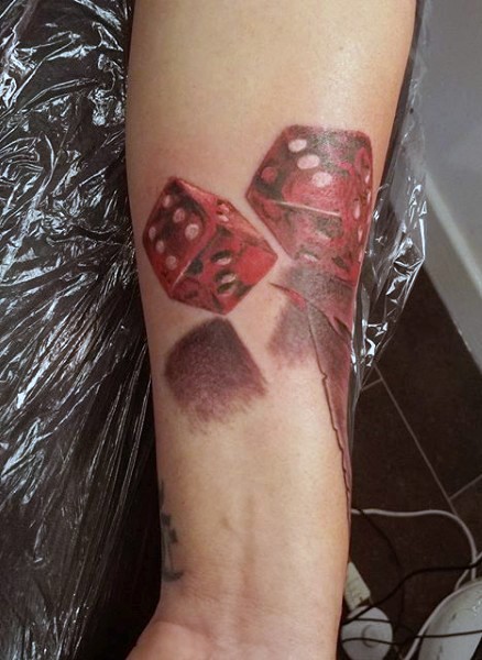 3D like colored and detailed dice tattoo on arm