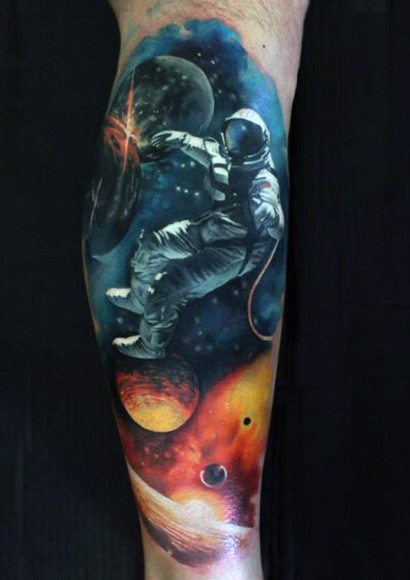 3D like colorful space with astronaut tattoo on leg
