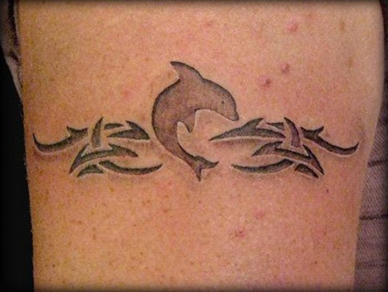 3D like little tribal dolphin tattoo on leg