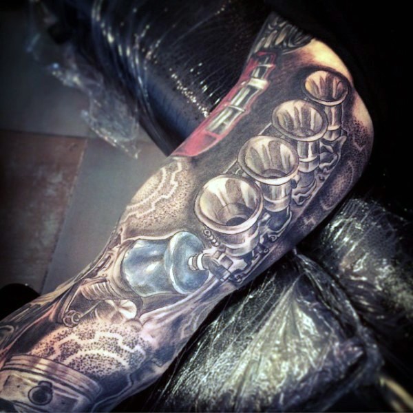 3D like multicolored mechanical tattoo on thigh