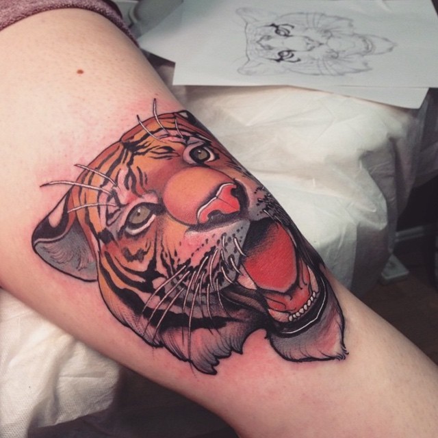 3D like multicolored natural looking arm tattoo of roaring tiger