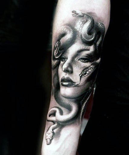 3D like natural looking evil Medusa head tattoo on arm