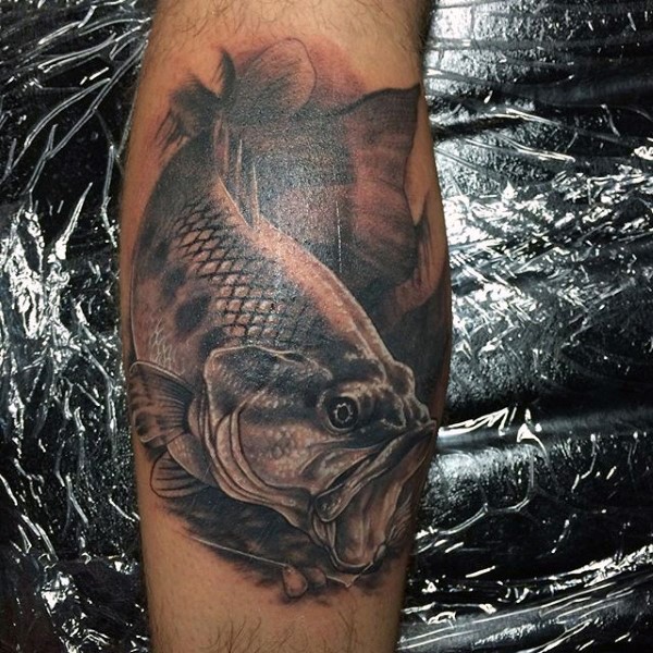 3D like realistic looking black ink big fish tattoo on leg