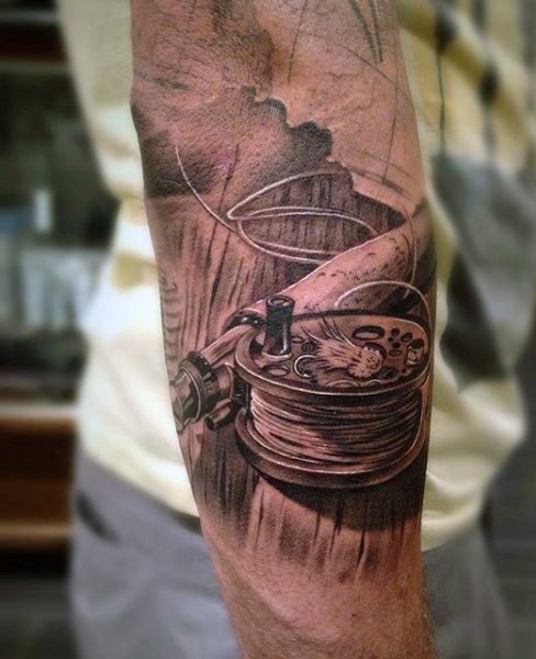3D like very realistic detailed black and white fishing rod tattoo on arm