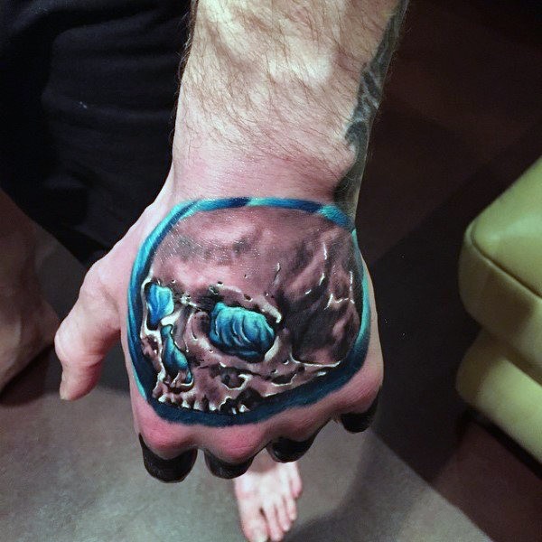 3D modern style hand tattoo of glowing human skull