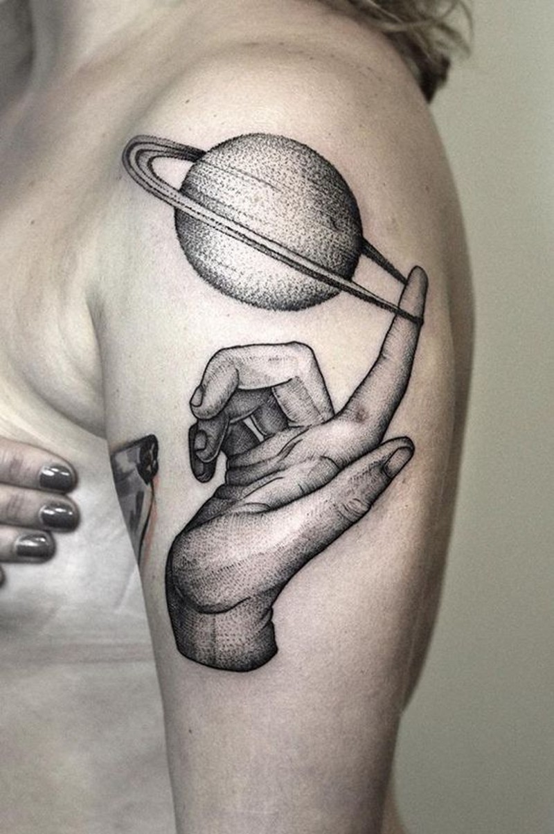 3D realistic amazing combined big planet with arm tattoo on shoulder