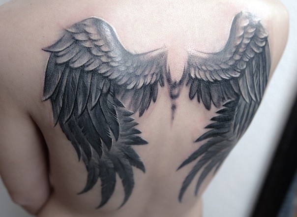 3D realistic big colored wings tattoo on upper back