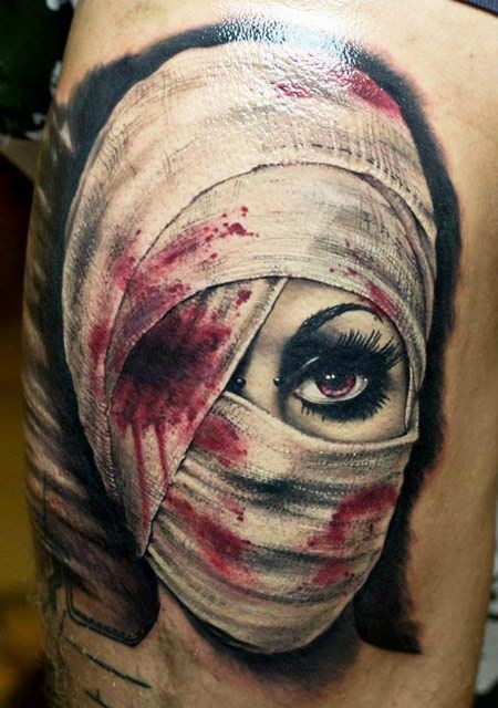 3D realistic colored creepy woman with wounded eye tattoo on thigh
