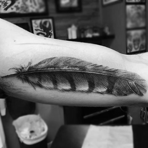 3D realistic detailed black and white feather biceps tattoo