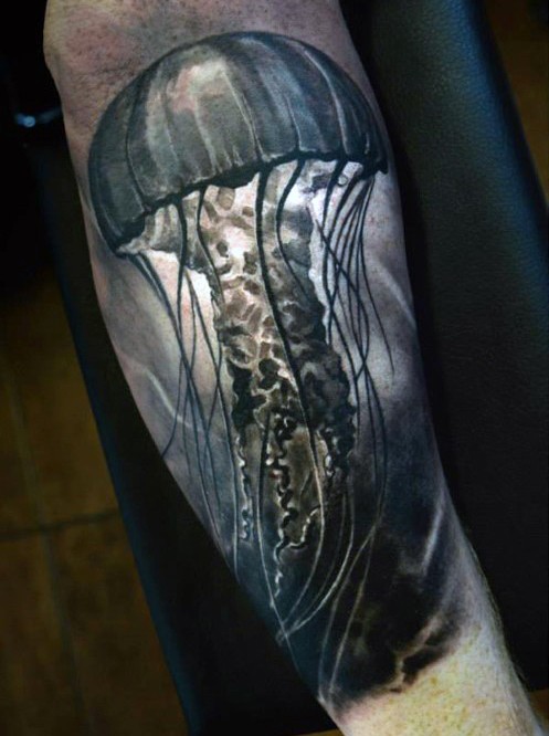 3D realistic looking big colored jellyfish tattoo on arm
