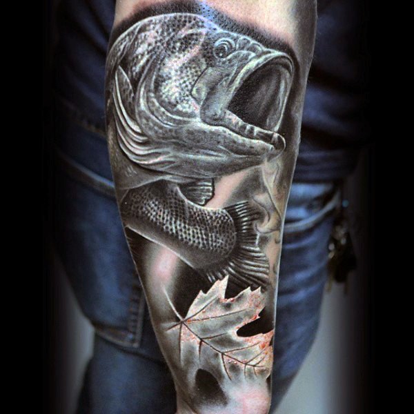 3D realistic looking black ink detailed fish with maple leaf tattoo on arm