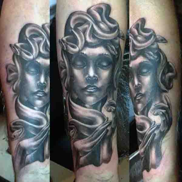 3D realistic looking black ink Medusa statue tattoo on arm