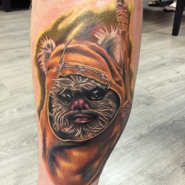 3D realistic looking colorful leg tattoo of ewok portrait