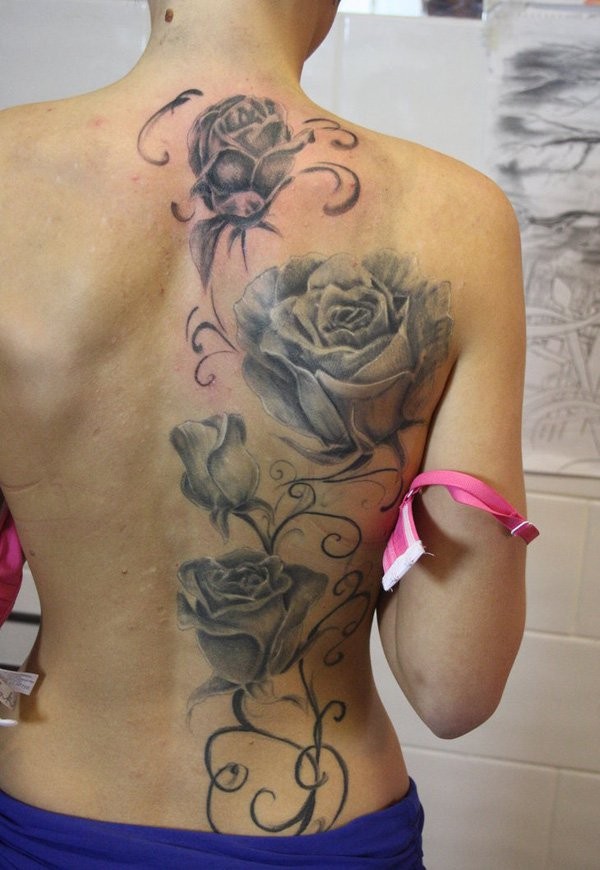 3D realistic massive very realistic flowers tattoo on back