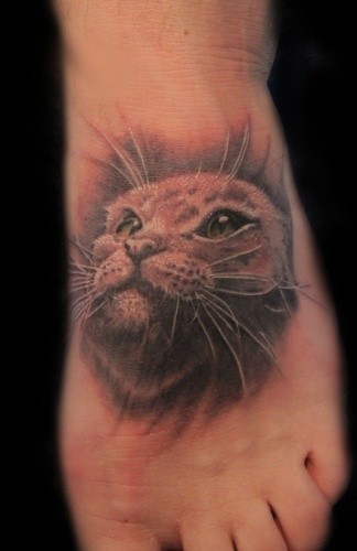 3D realistic pale colored cat&quots portrait tattoo on foot
