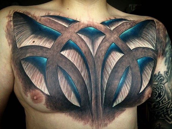 3D sty;e cp;pred whole chest tattoo of various ornaments