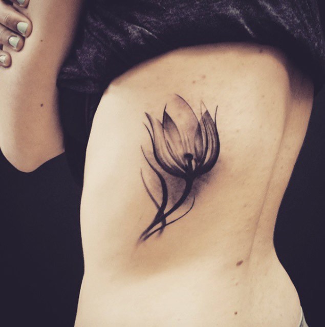 3D style beautiful black ink mystic flower tattoo on back zone