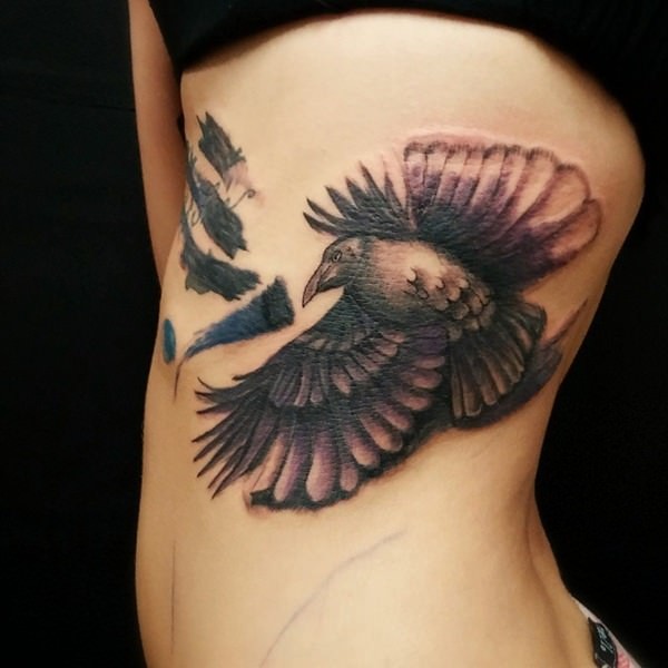 3D style big colored crow tattoo on side zone