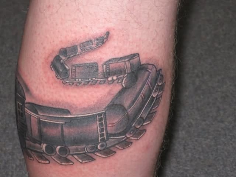 3D style black and gray leg tattoo of train carts