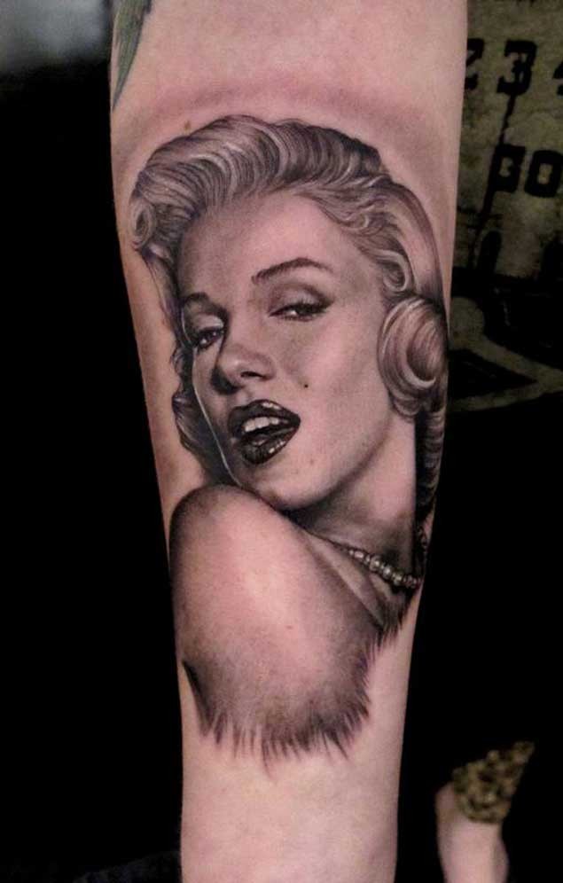 3D style black ink natural looking forearm tattoo of Merlin Monroe portrait