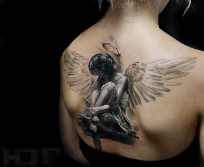 3D style breathtaking looking back tattoo of sad female angel