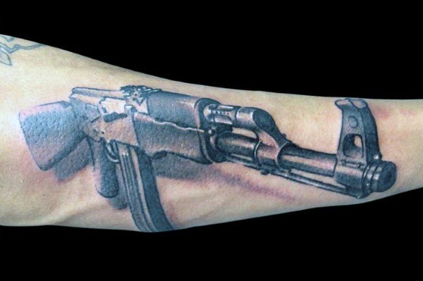 3D style colored arm tattoo of AK 47 rifle