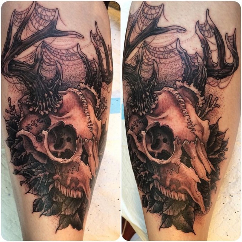 3D style colored deers skull with leaves tattoo on leg