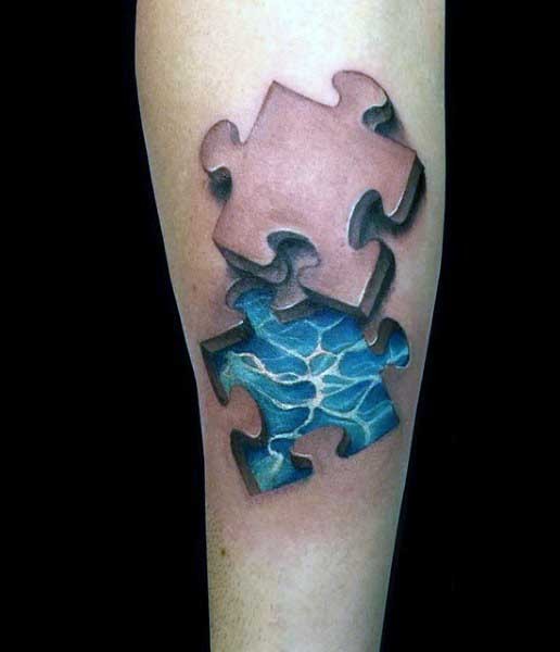 3D style colored forearm tattoo of puzzle pieces and water