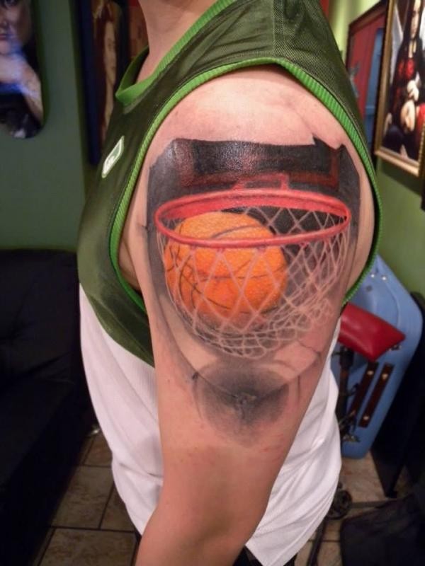 3D style colored shoulder tattoo of basketball net and ball