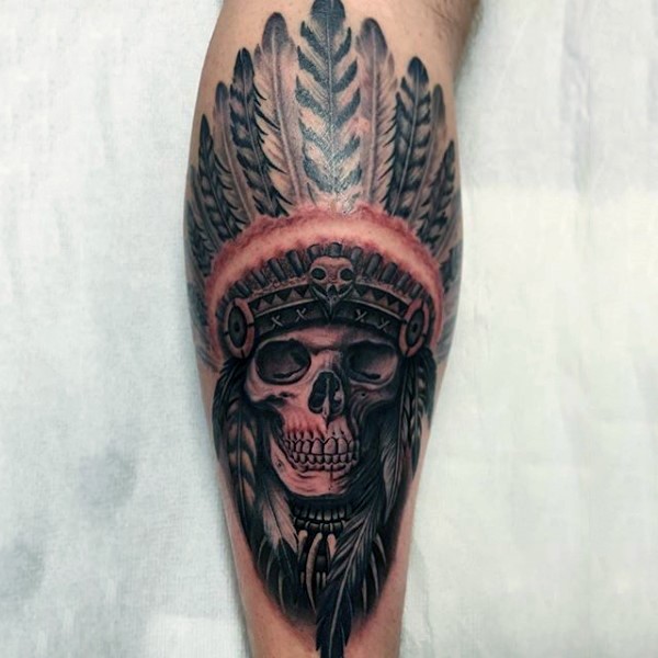 3D style colored very detailed Indian chief skull tattoo on leg muscle