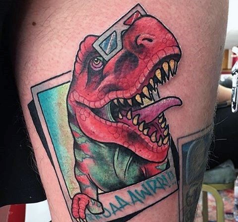 3D style illustrative style colored arm tattoo of dinosaur with lettering