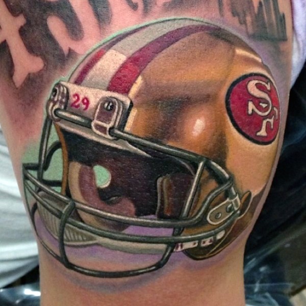 3D style large arm tattoo of American football player helmet
