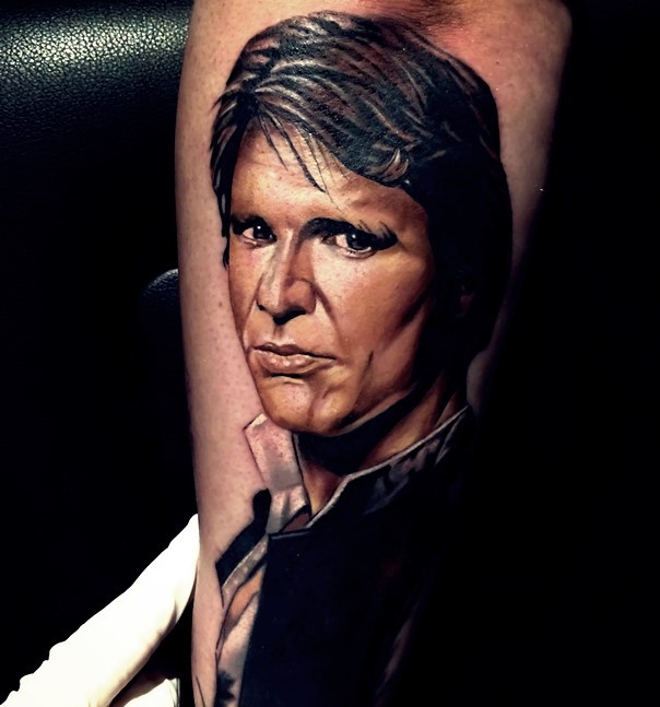 3D style natural looking colored forearm tattoo of fancy Han Solo portrait