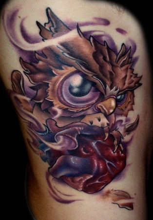 3D style nice colored arm tattoo of owl with heart