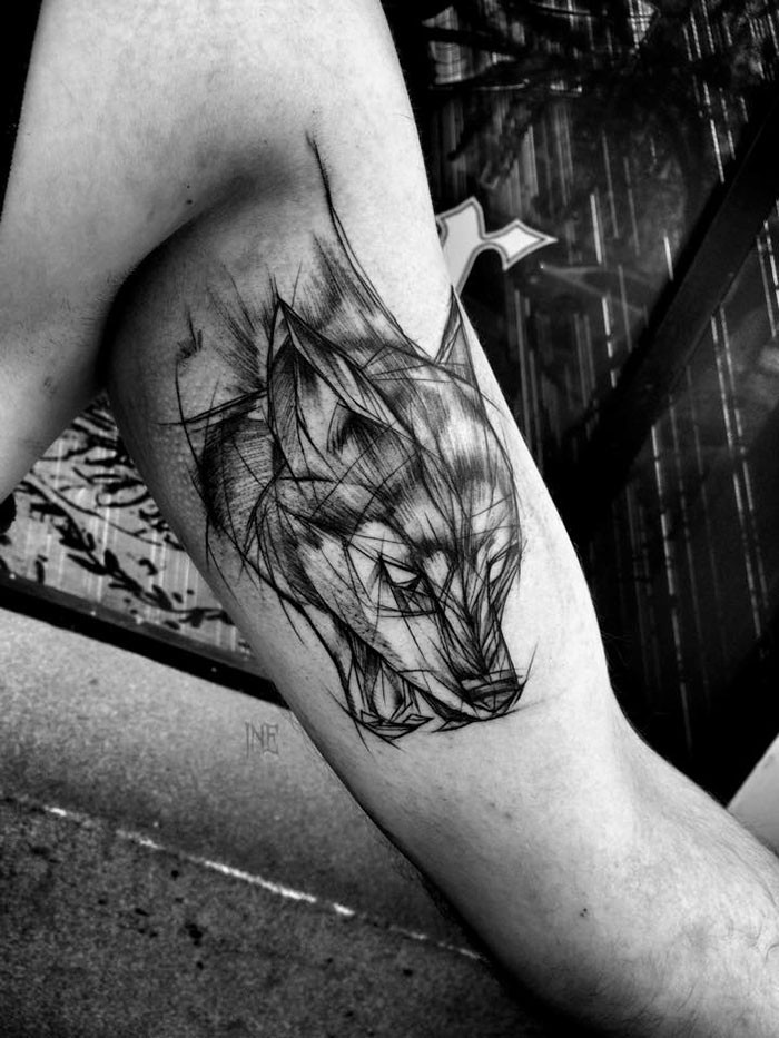 3D style nice painted by Inez Janiak biceps tattoo of fox head