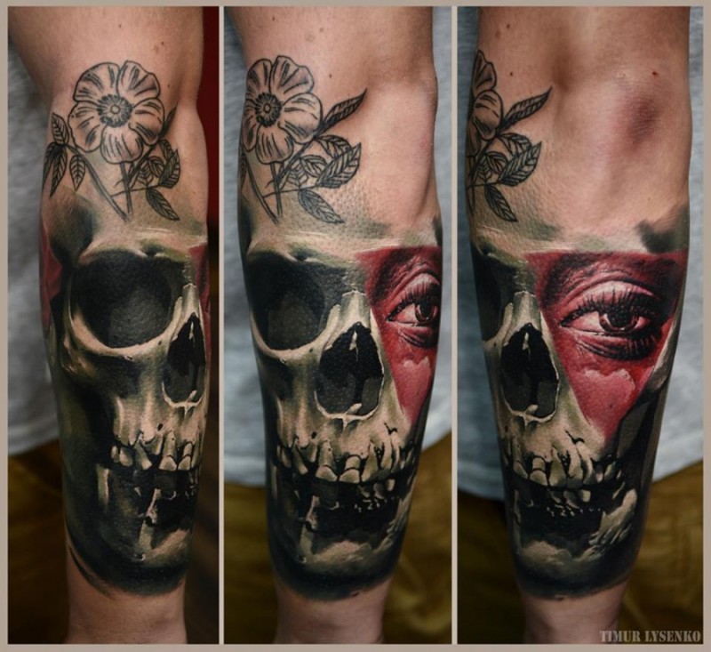3D style painted and colored mysterious human skull tattoo on forearm with flower and eye