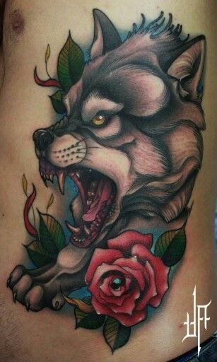 3D style painted big colored horrifying roaring wolf tattoo on side stylized with flowers and leaves